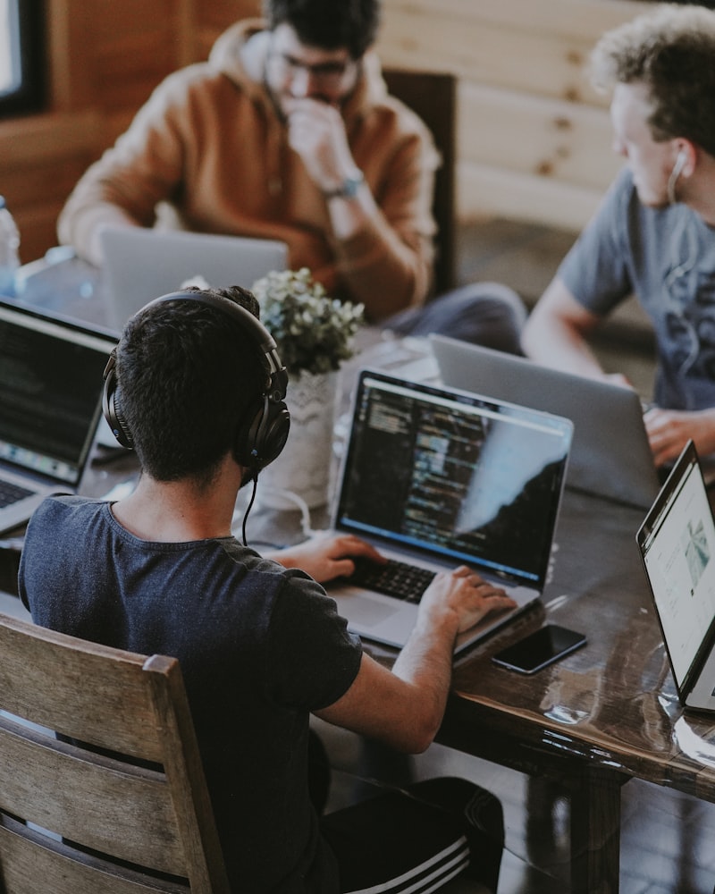 A development team working together on laptops